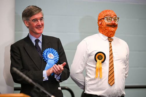 Jacob Rees-Mogg stands next to Phin “Barmy Brunch” Adams, a Monster Raving Loony Party candidate
